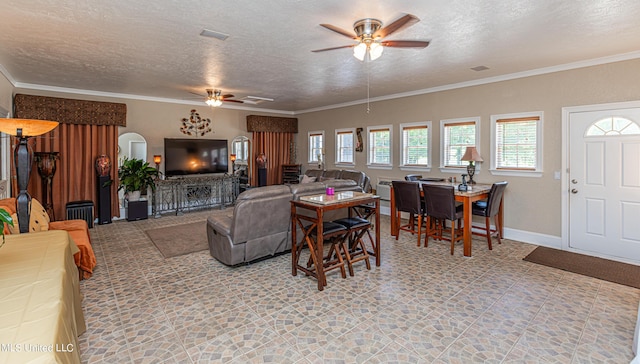 1000 Cedar Hill Rd, Madison, MS 39110 - living room featuring a ceiling fan, a textured ceiling, arched walkways, and ornamental molding