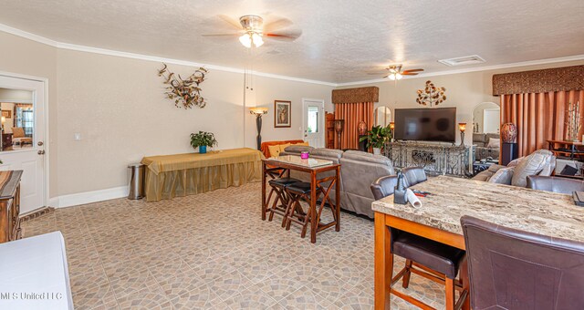 1000 Cedar Hill Rd, Madison, MS 39110 - dining room featuring ceiling fan, ornamental molding, a textured ceiling, and baseboards