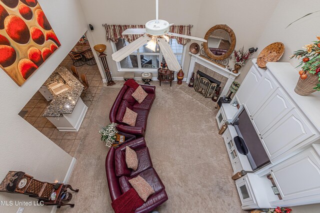 1000 Cedar Hill Rd, Madison, MS 39110 - tiled living area with a tiled fireplace and vaulted ceiling