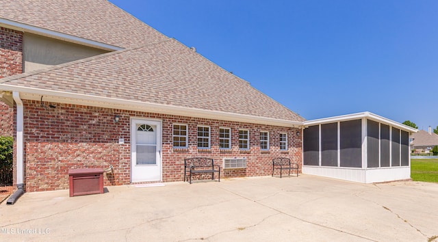 1000 Cedar Hill Rd, Madison, MS 39110 - rear view of property featuring a sunroom, roof with shingles, brick siding, and a patio