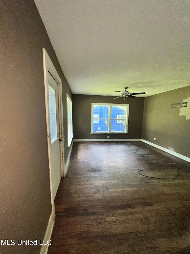 4515 25th St, Meridian, MS 39307 - spare room with dark wood-style floors, ceiling fan, and baseboards