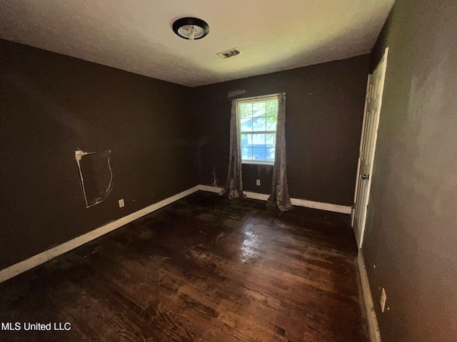 4515 25th St, Meridian, MS 39307 - unfurnished room featuring dark wood-type flooring and baseboards