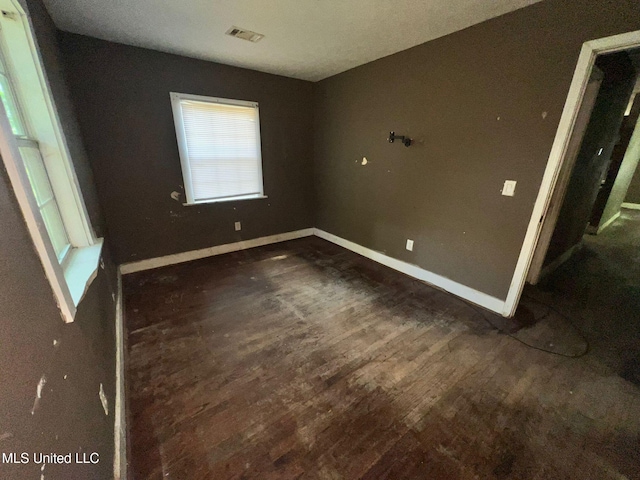 4515 25th St, Meridian, MS 39307 - unfurnished bedroom featuring baseboards and wood finished floors