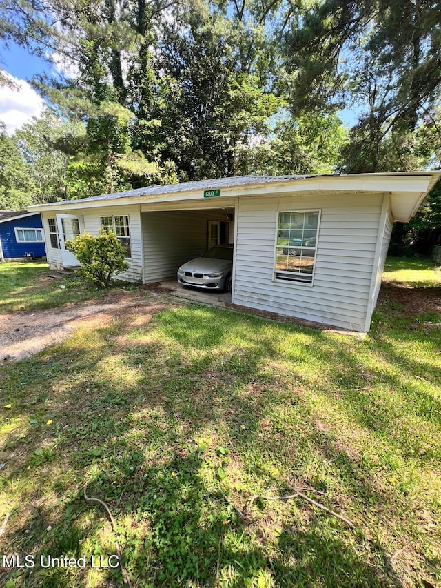 4515 25th St, Meridian, MS 39307 - view of front of property with a carport and a front lawn