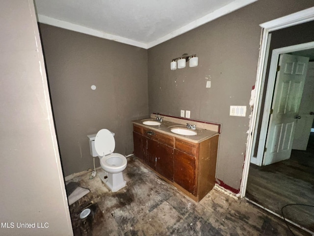 4515 25th St, Meridian, MS 39307 - full bathroom featuring toilet, double vanity, and baseboards