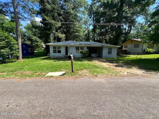 4515 25th St, Meridian, MS 39307 - view of front of property with metal roof, driveway, view of scattered trees, and a carport