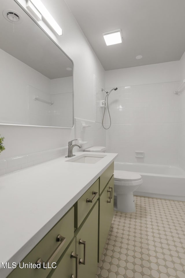 bathroom with tile patterned floors, vanity, toilet, and shower / bath combination