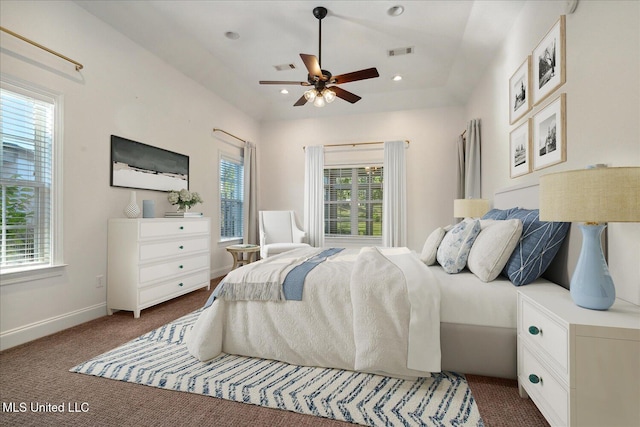 bedroom with dark carpet and ceiling fan