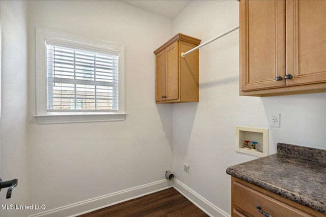 laundry area with dark wood-type flooring, cabinets, and washer hookup