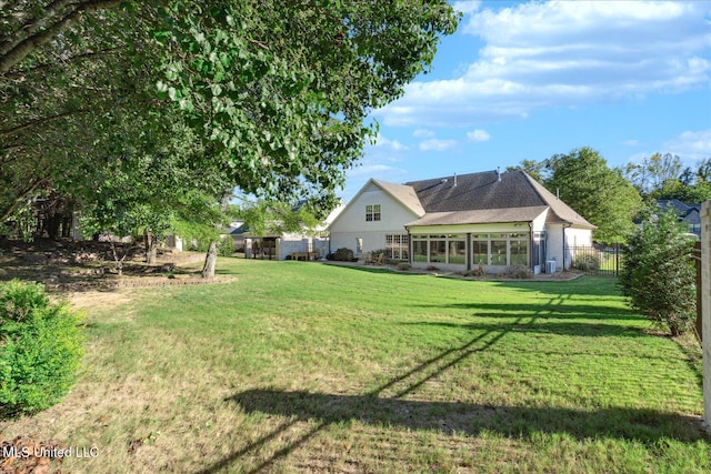 view of yard featuring a sunroom