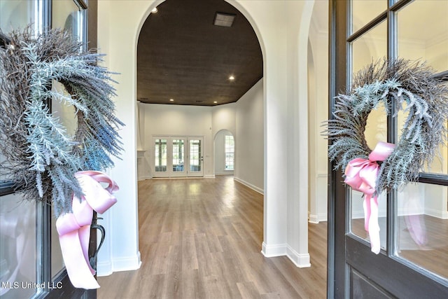 hallway with hardwood / wood-style floors