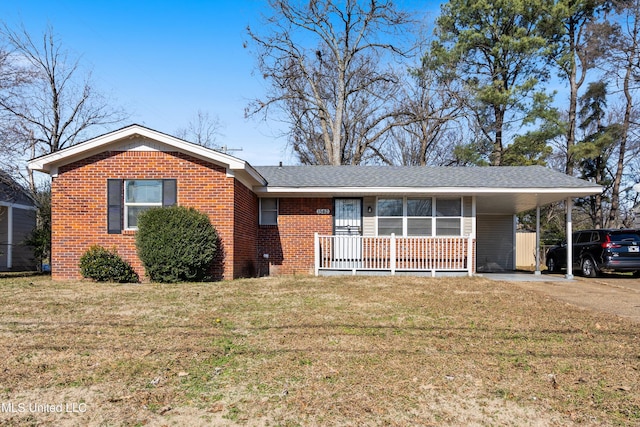 single story home with a front yard and a carport