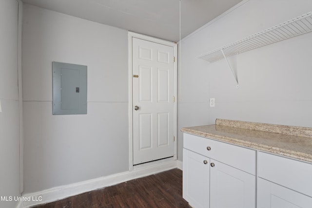 washroom featuring electric panel and dark wood-type flooring