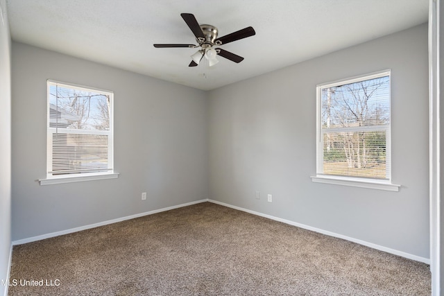 carpeted empty room featuring ceiling fan