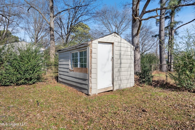 view of outdoor structure featuring a lawn