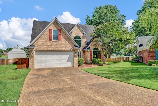 8968 Tahoe Cv, Olive Branch, MS 38654 - view of front facade featuring brick siding, concrete driveway, and roof with shingles