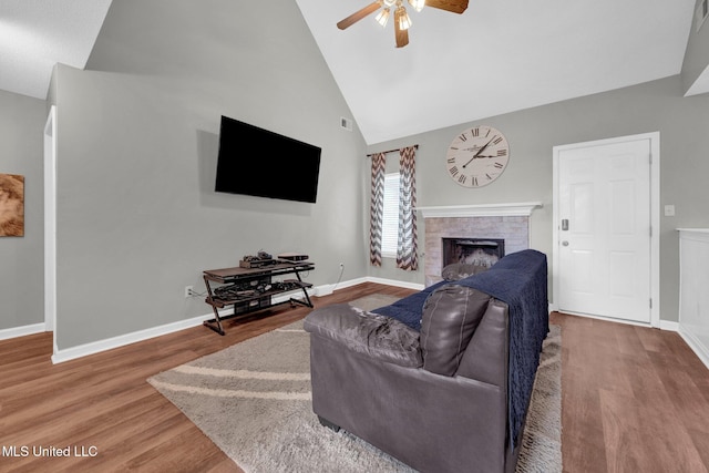 8968 Tahoe Cv, Olive Branch, MS 38654 - living room featuring a ceiling fan, a brick fireplace, wood finished floors, and high vaulted ceiling