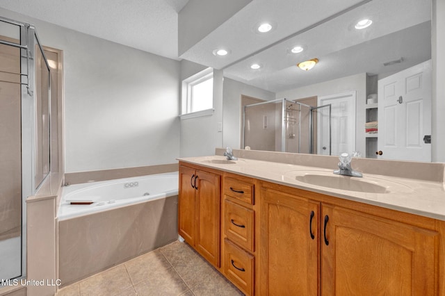 8968 Tahoe Cv, Olive Branch, MS 38654 - bathroom with a shower stall, double vanity, a garden tub, recessed lighting, and tile patterned flooring