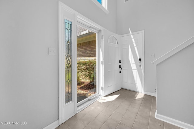 8968 Tahoe Cv, Olive Branch, MS 38654 - foyer with light tile patterned floors and a high ceiling