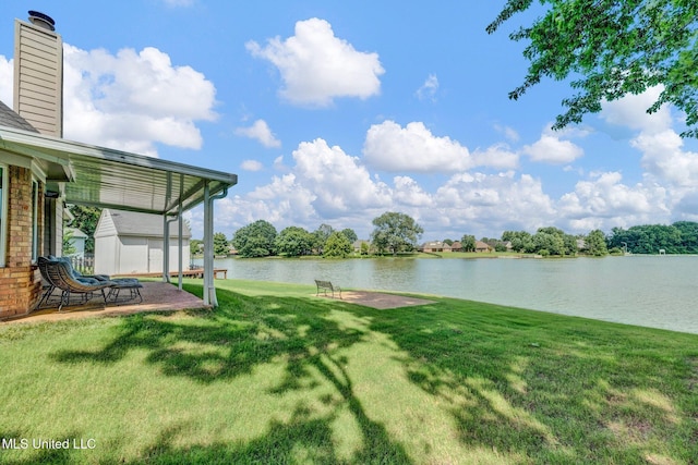 8968 Tahoe Cv, Olive Branch, MS 38654 - view of green lawn with a water view and a patio