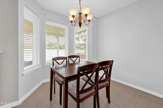 8968 Tahoe Cv, Olive Branch, MS 38654 - dining space with healthy amount of natural light, a chandelier, and light tile patterned floors