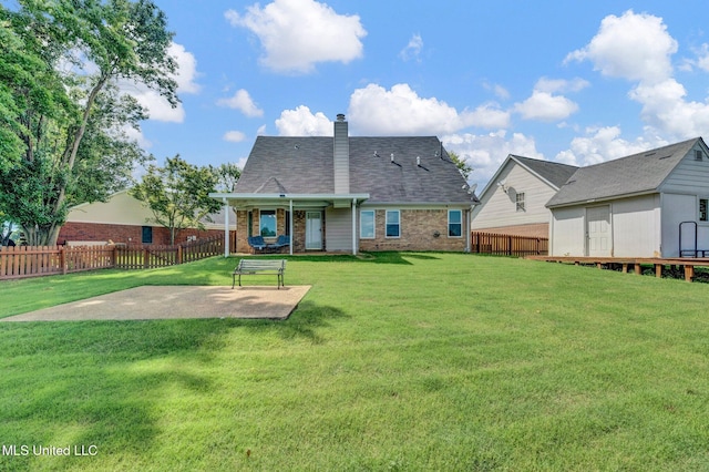 8968 Tahoe Cv, Olive Branch, MS 38654 - back of house with brick siding, a patio area, a chimney, and a fenced backyard