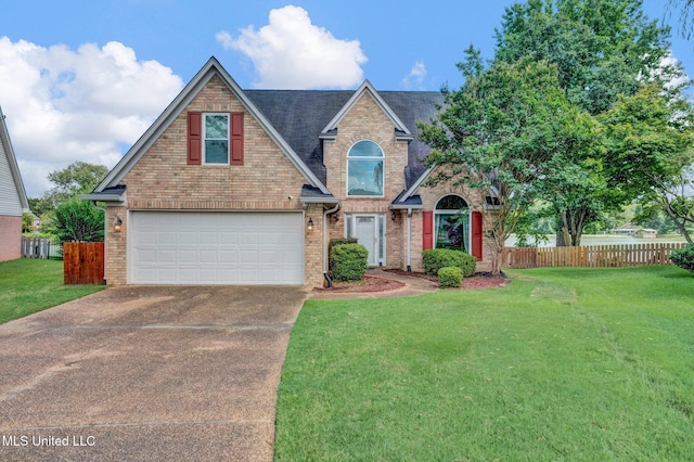 8968 Tahoe Cv, Olive Branch, MS 38654 - traditional-style home with brick siding, concrete driveway, and an attached garage