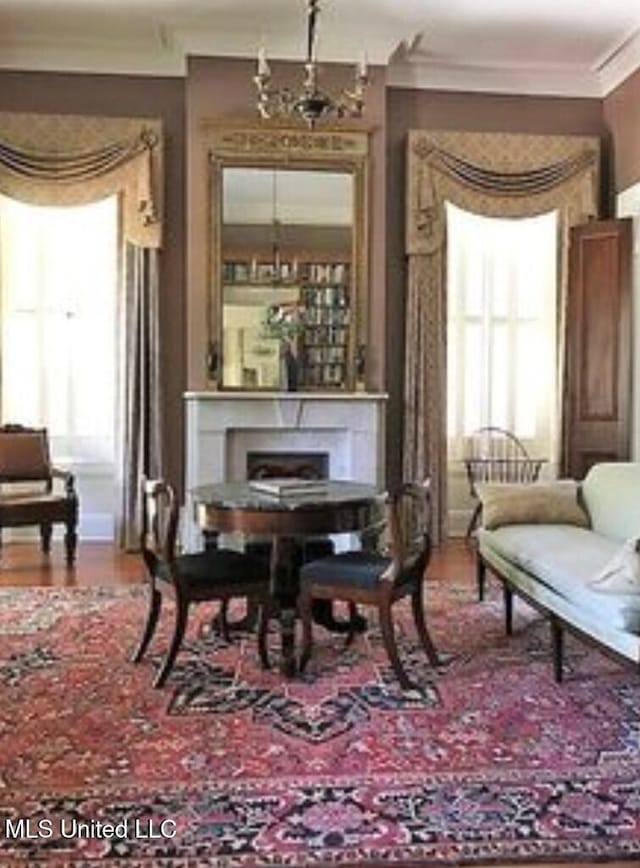 living area with crown molding