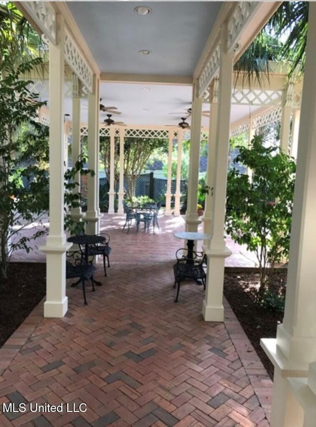 view of patio featuring ceiling fan