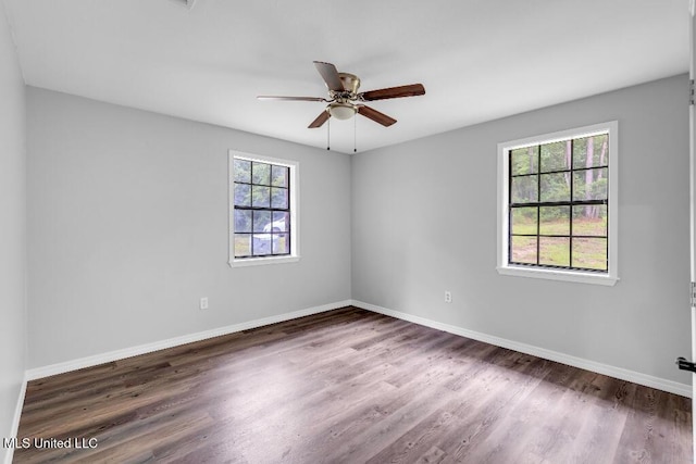 29 Summer Ln, Poplarville, MS 39470 - empty room with a ceiling fan, wood finished floors, and baseboards