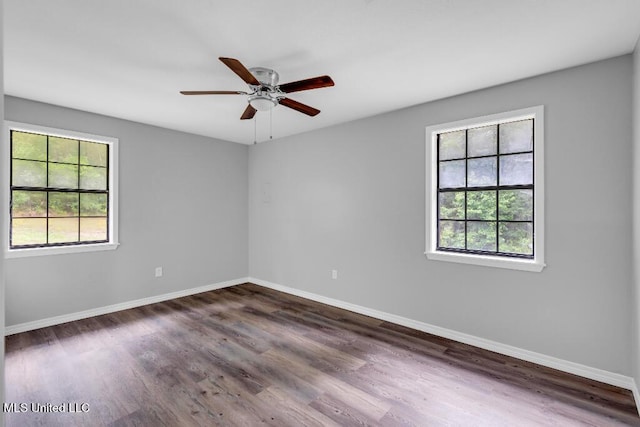 29 Summer Ln, Poplarville, MS 39470 - empty room featuring baseboards, dark wood-style flooring, and ceiling fan