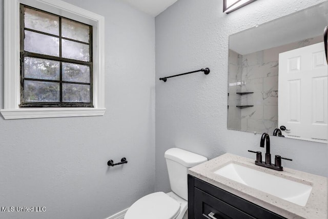 29 Summer Ln, Poplarville, MS 39470 - bathroom featuring vanity, toilet, and healthy amount of natural light