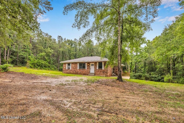 29 Summer Ln, Poplarville, MS 39470 - view of front of home with a forest view and brick siding