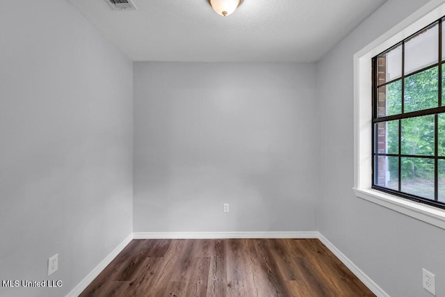 29 Summer Ln, Poplarville, MS 39470 - empty room with dark wood-style floors and baseboards