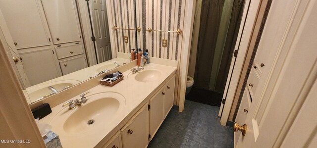 32 Raintree Pl, Jackson, MS 39211 - bathroom featuring toilet, a sink, tile patterned floors, and wallpapered walls