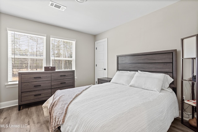 bedroom with light hardwood / wood-style floors