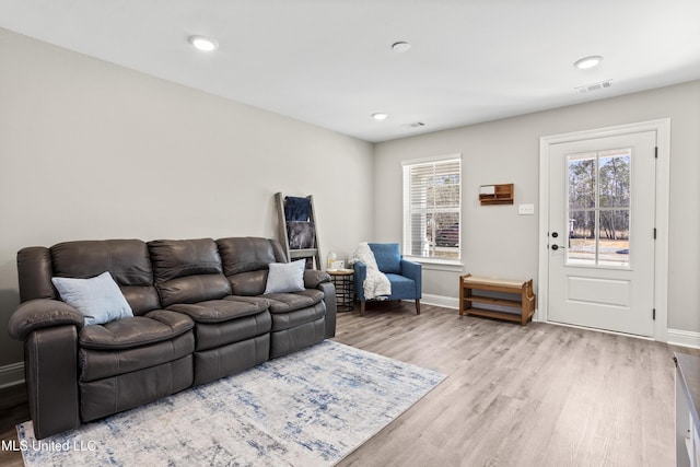 living room with light hardwood / wood-style floors