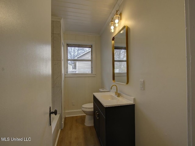 full bathroom with crown molding, vanity, toilet, and wood finished floors