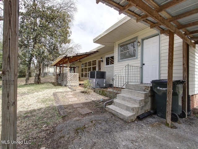 rear view of house with central air condition unit