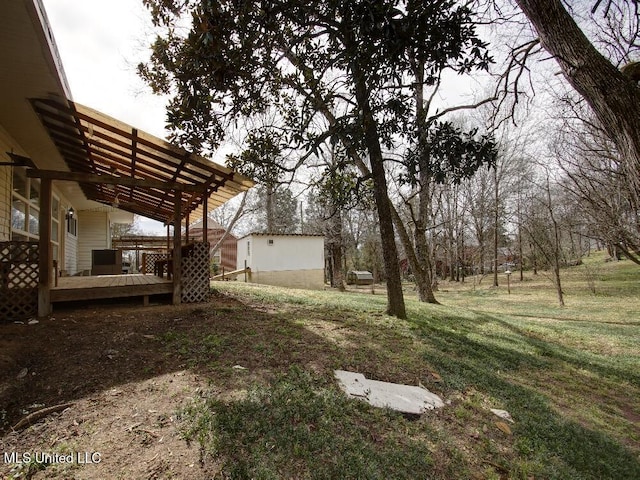 view of yard featuring a wooden deck