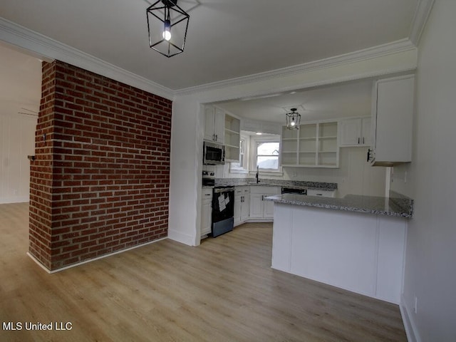 kitchen featuring appliances with stainless steel finishes, white cabinets, a sink, and open shelves