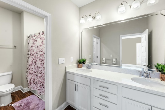 full bathroom featuring shower / tub combo with curtain, toilet, vanity, and hardwood / wood-style floors