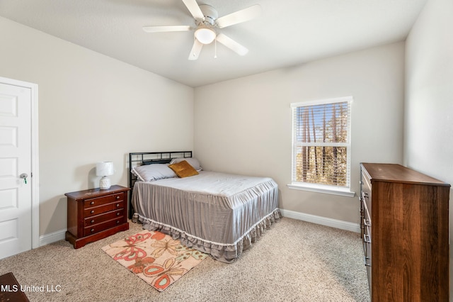 bedroom featuring light carpet and ceiling fan