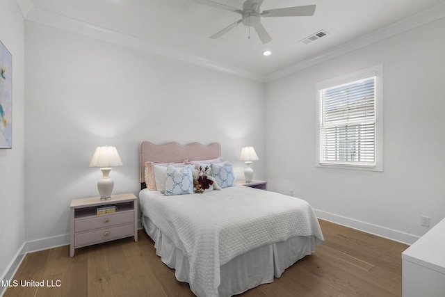 bedroom featuring wood-type flooring, ceiling fan, and ornamental molding