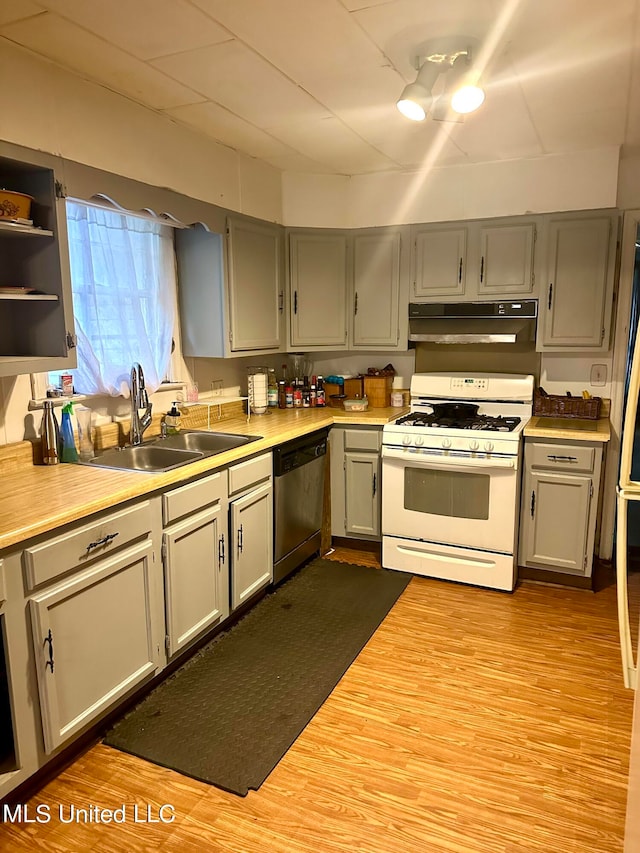 2236 Long St, Grenada, MS 38901 - kitchen featuring dishwasher, gas range gas stove, sink, light wood-type flooring, and gray cabinets