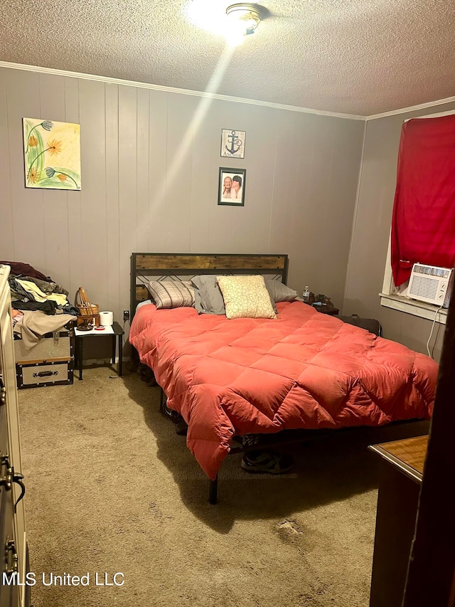 2236 Long St, Grenada, MS 38901 - bedroom with a textured ceiling, cooling unit, carpet floors, and wood walls