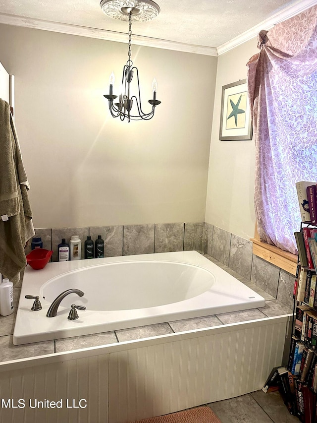2236 Long St, Grenada, MS 38901 - bathroom featuring a textured ceiling, tile patterned floors, a bathing tub, crown molding, and a notable chandelier