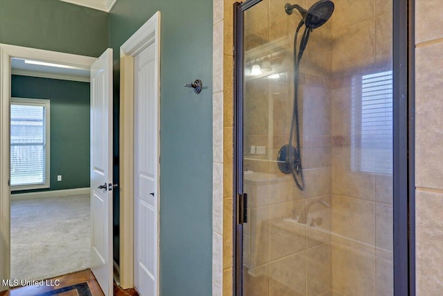 bathroom featuring a shower with shower door