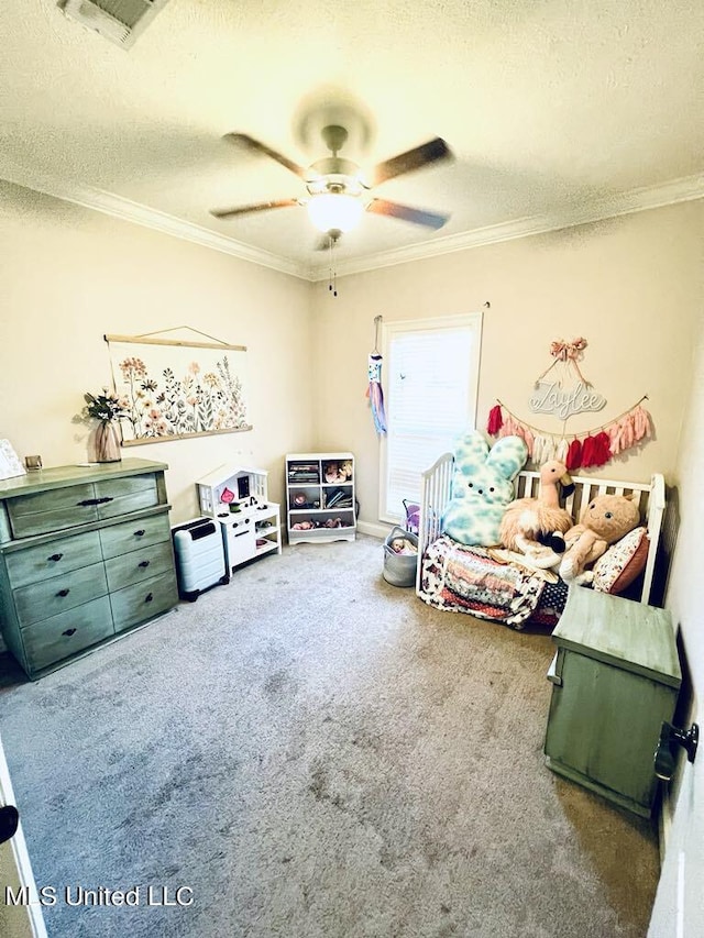 carpeted bedroom featuring ceiling fan, ornamental molding, and a textured ceiling