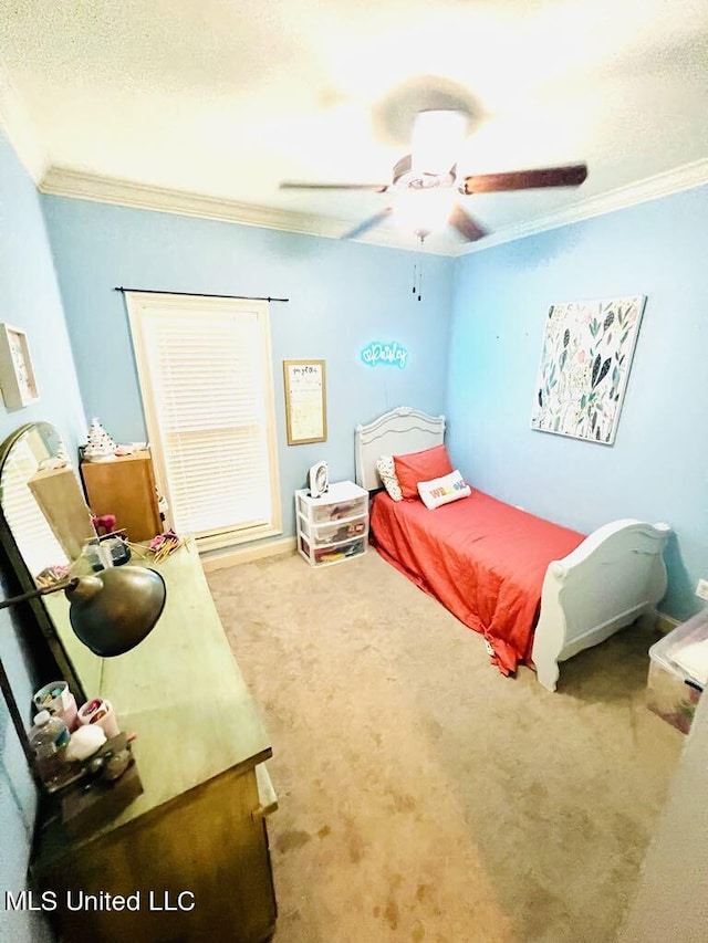 carpeted bedroom with ceiling fan and crown molding